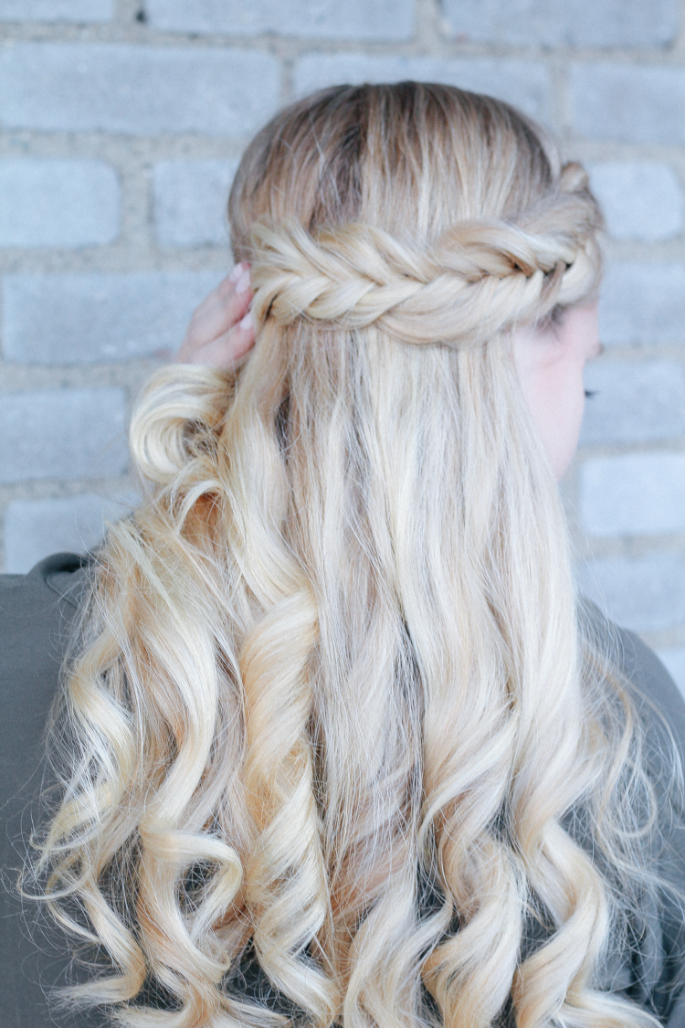 curled hair with fishtail braids