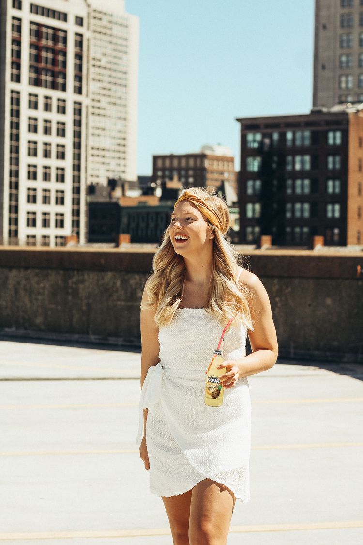 spring outfit in boston | best views of boston | where to go for the best views in Boston | Princess Polly Boutique Dress | White wrap dress for spring | dress with sneakers | parking garage views in Boston | why you should do those things that scare you | do all of the things that scare you | princess polly dresses |